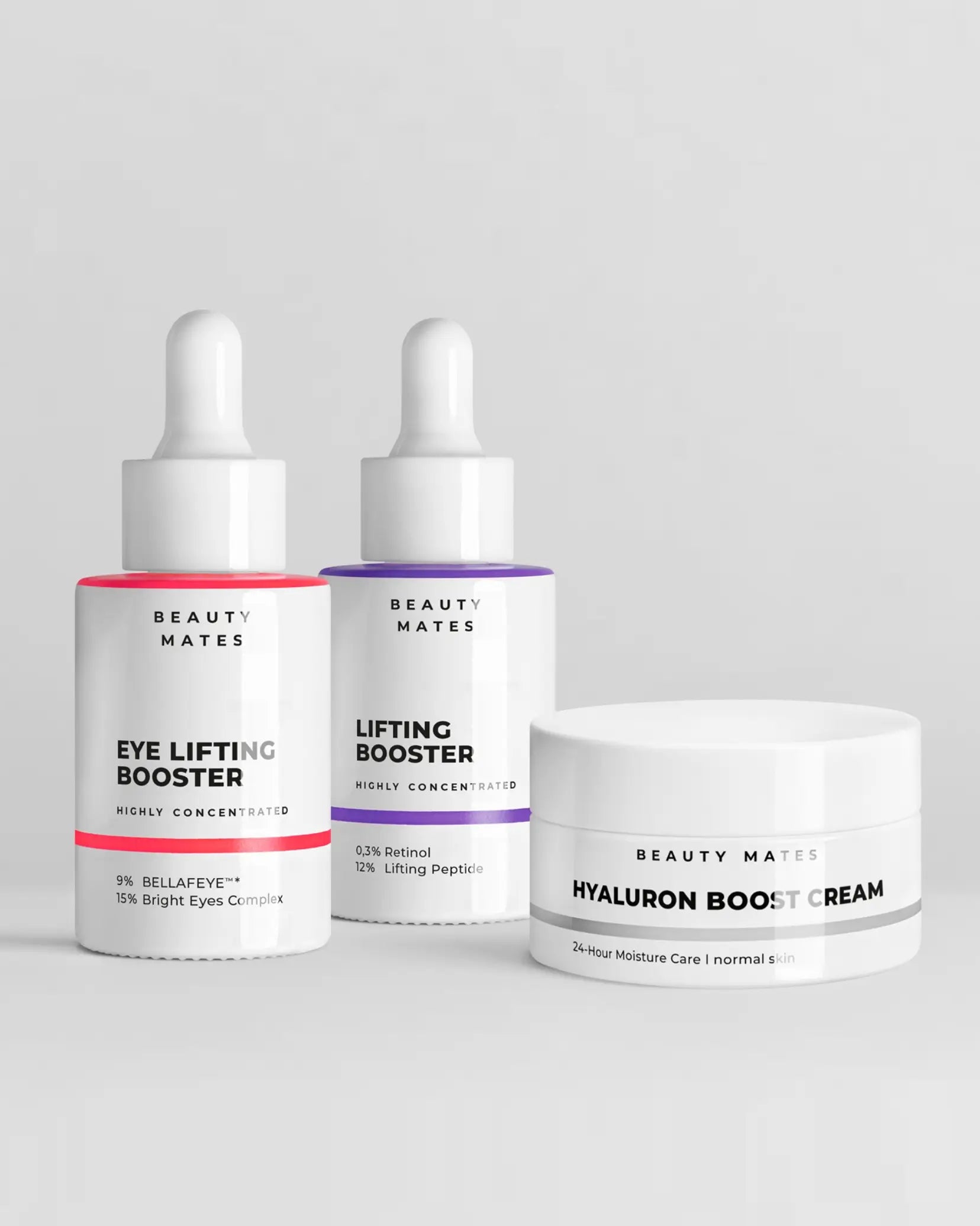 Beauty Mates Eye Lifting Booster, Lifting Booster und Hyaluron Boost Cream nebeneinander auf grauem Hintergrund.